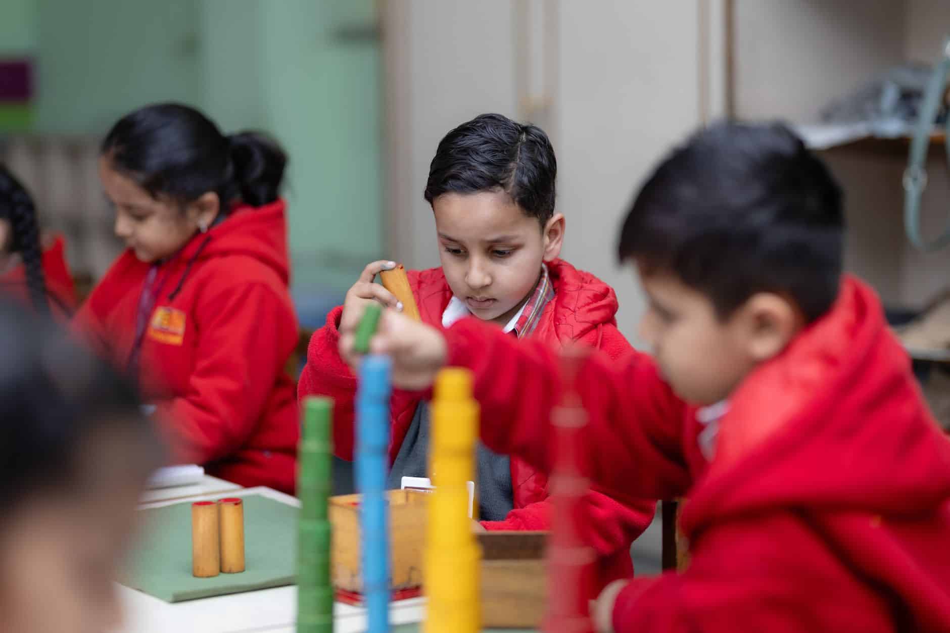 children engaged in montessori learning activities