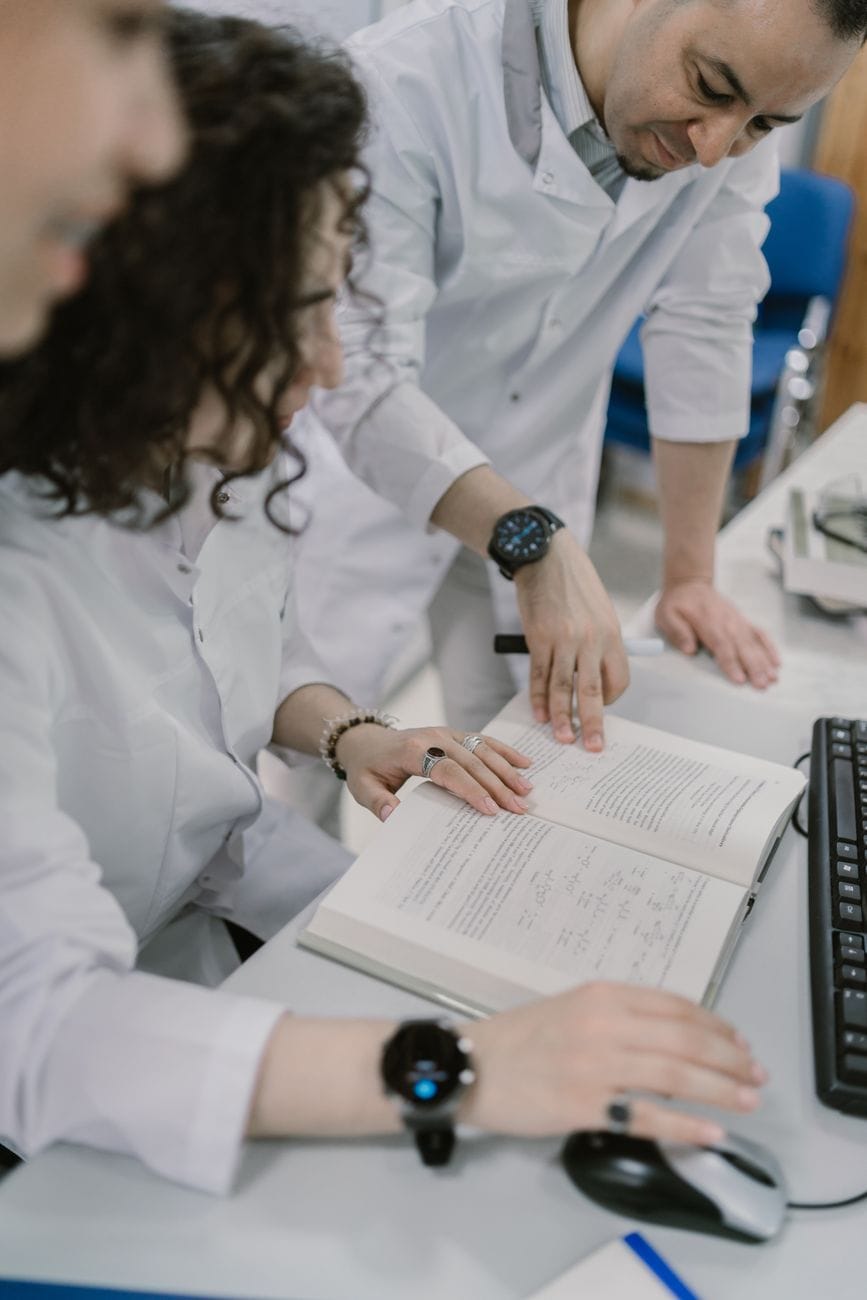 scientists reading a book
