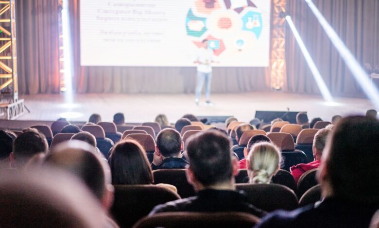 people sitting inside the auditorium