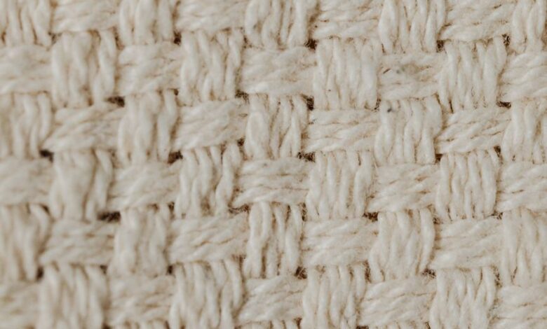 close up shot of a beige knitted textile