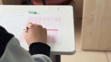 student taking exam in classroom setting
