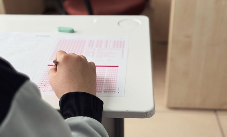 student taking exam in classroom setting